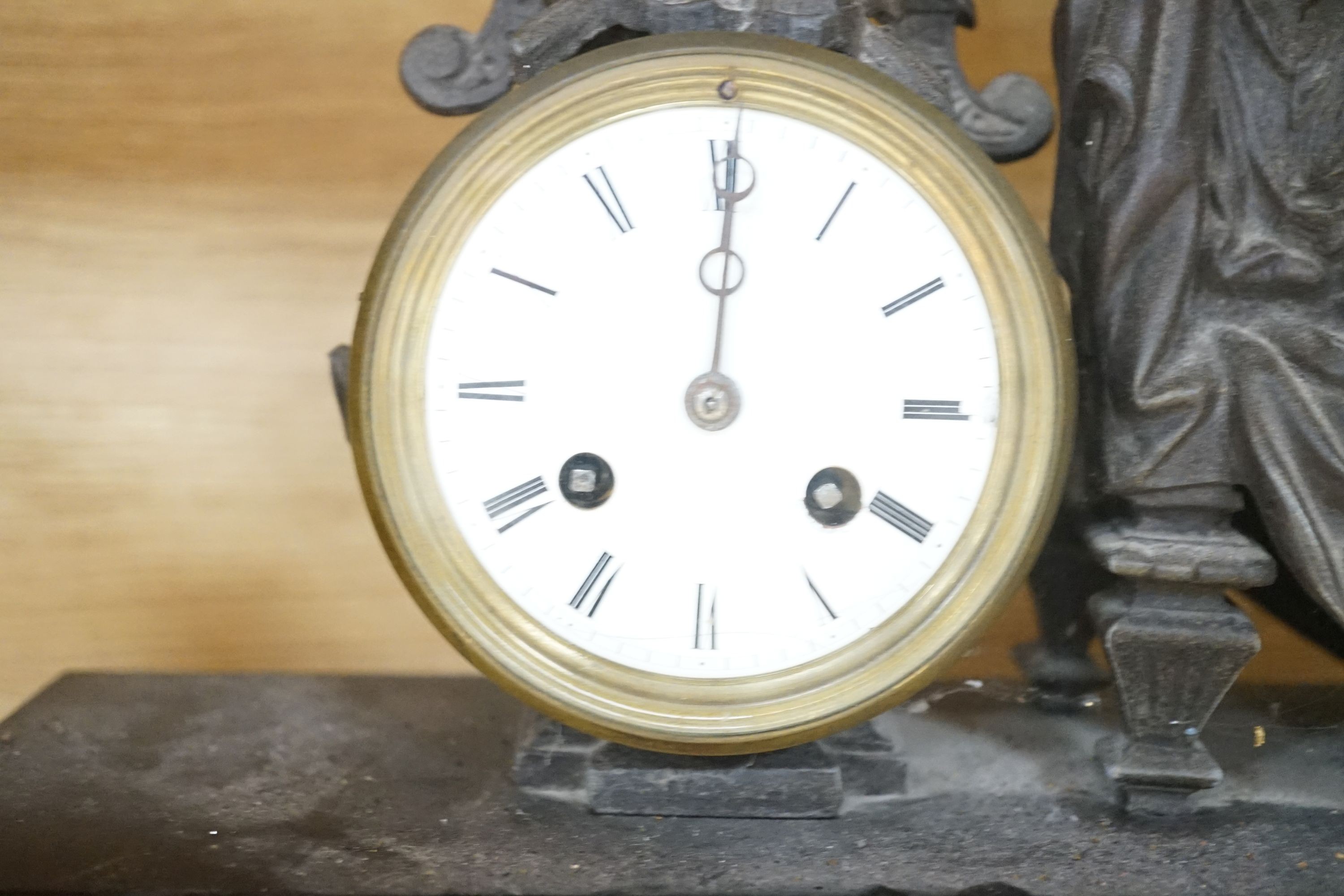 An inlaid mahogany mantel clock, slate mantel clock and a figural spelter mantel clock (3)
